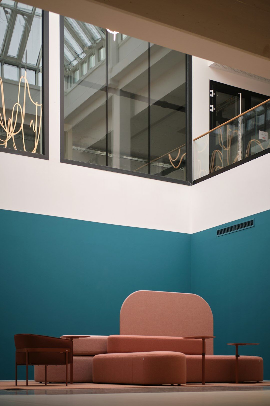 Modern media company office reception area with lounge seating