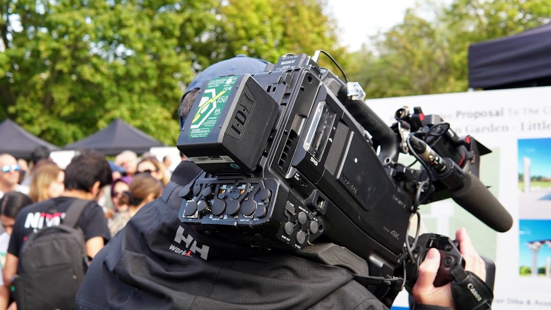 Satellite uplink broadcast truck parked outside a news event