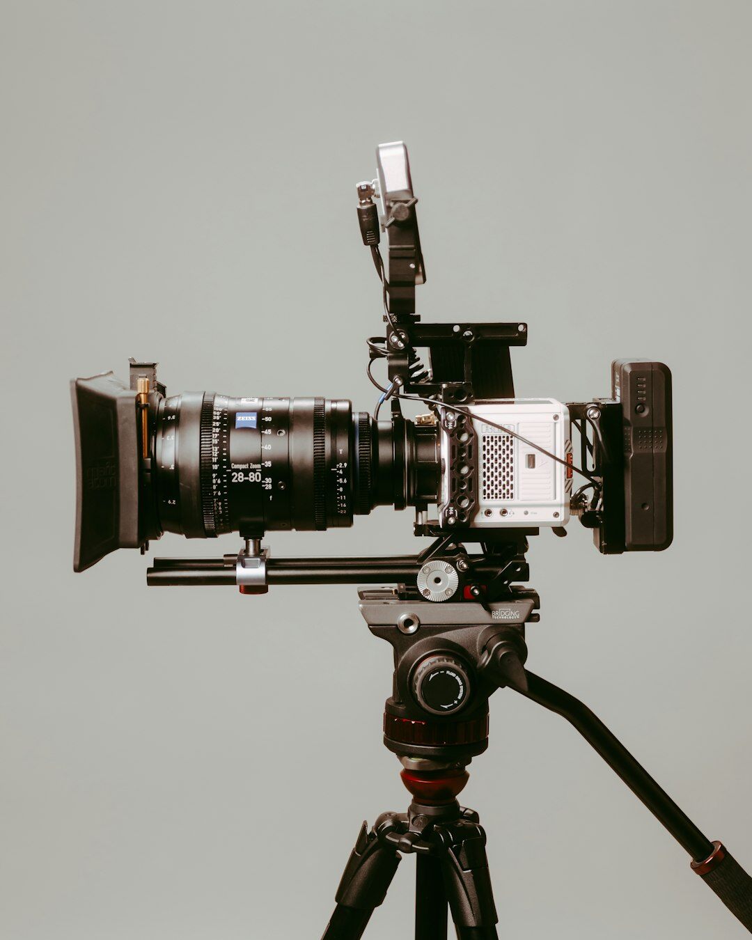 Close-up of a professional broadcast camera lens on set