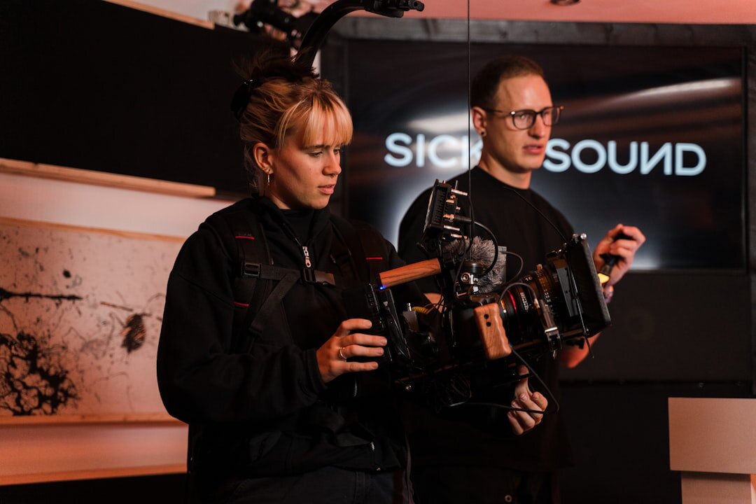 Diverse team of Finnish broadcast production professionals standing together in a studio